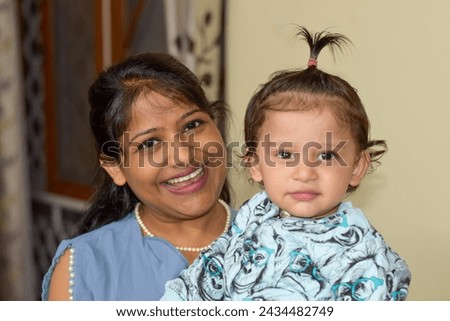 Mother and child posing for photograph