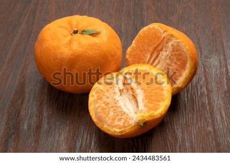 Japanese citrus ponkan on white background Royalty-Free Stock Photo #2434483561