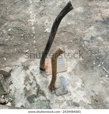 A hoe is a type of traditional tool used in agriculture to dig, clear the ground from grass or to level the land