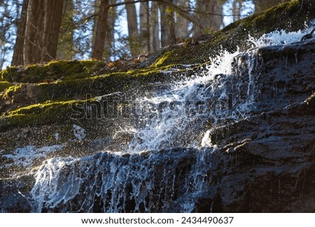 Patterns of falling water are revealed with a high shutter speed, stopping action in part of Blackledge Falls in Glastonbury, Connecticut.