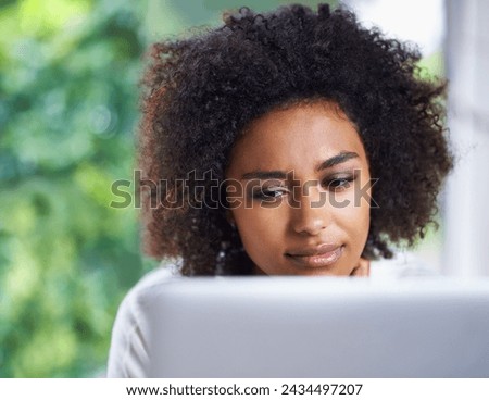 Face, laptop and thinking with afro black woman in living room of home for research or remote work. Computer, planning or problem solving with young freelance employee or entrepreneur in apartment