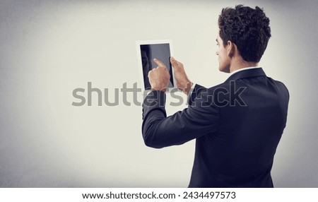 Tablet, research and business man in studio isolated on gray background mockup space for communication. Digital technology, consultant and professional scroll on screen, back or reading email on app