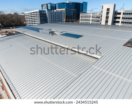 Metal Roof On Commercial Building - Drone  Royalty-Free Stock Photo #2434515245