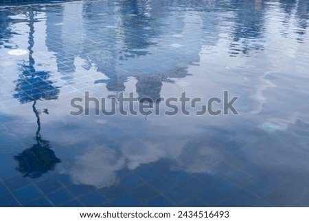 the shadow of the mosque dome reflecting in the water