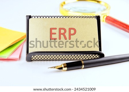 Abbreviation ERP - Enterprise Resource Planning on a gold business card with highlighted text
