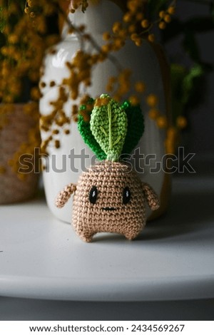 Hand made crochet plant with roots
