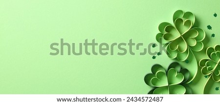 St Patricks day banner design with four leaf clover paper art on green background.