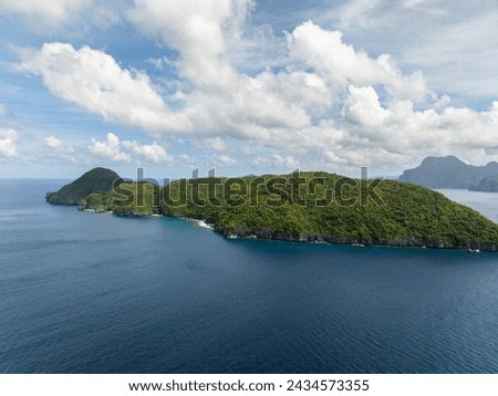 Inambuyod Island. Blue sky and clouds. El Nido, Philippines.