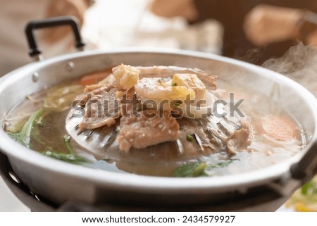 Grill barbecue on pan and hot pot street buffet thai style. (Moo Kra Ta) Royalty-Free Stock Photo #2434579927