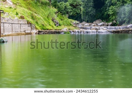 small waterfall with a small lake near Bhimtal. Landscape view of a small waterfall in the mountains. crystalline waterfall.
 Royalty-Free Stock Photo #2434612255