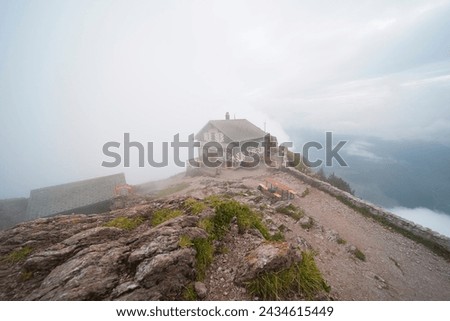 On the summit of the "Grossen mythen". The mountain is in Switzerland in the canton of Schwyz and is 1898m high. In the picture you can see the mountain restaurant on a foggy day.