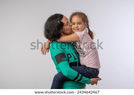 mother and daughter studio portrait happy family Royalty-Free Stock Photo #2434642467