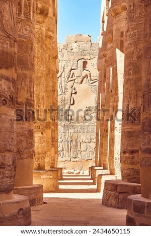 Karnak Temple Great Hypostyle Hall Pillars in Luxor - ancient Thebes. Pillars with Egyptian hieroglyphs. Popular Egyptian landmark. Ancient Egypt. Vacation destination. Historic site Royalty-Free Stock Photo #2434650115