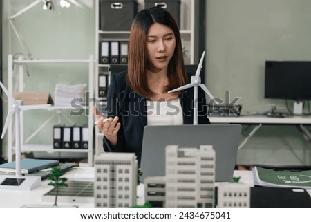 Female using tablet for working technology and business,  Renewable energy-based green businesses and global warming. Reduce CO2 emission.