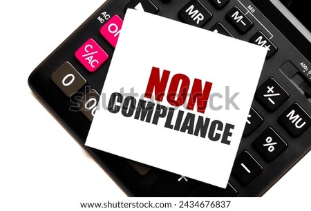 NON COMPLIANCE text on note with calculator background. Financial regulation concept Royalty-Free Stock Photo #2434676837