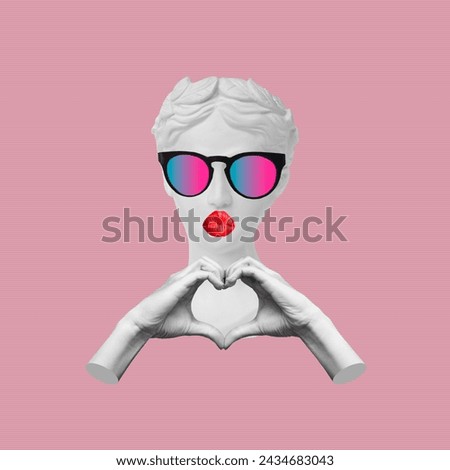 Antique female statue's head with red kissing lips with bow showing heart shape with hands isolated on pink color background. Feelings and emotions. 3d trendy collage. Contemporary art. Modern design