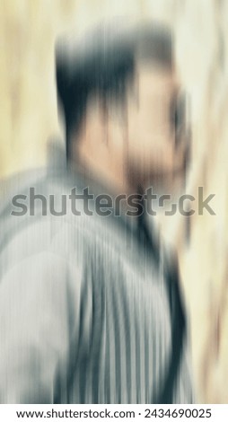 A detective or police man finding a clue in the place of murder. Motion blurred image
