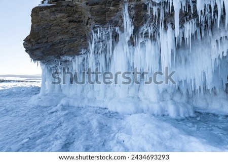 Coast of lake Baikal in winter, the deepest and largest freshwater lake by volume in the world, located in southern Siberia, Russia Royalty-Free Stock Photo #2434693293