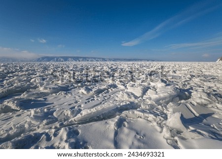 Lake Baikal in winter, the deepest and largest freshwater lake by volume in the world, located in southern Siberia, Russia Royalty-Free Stock Photo #2434693321