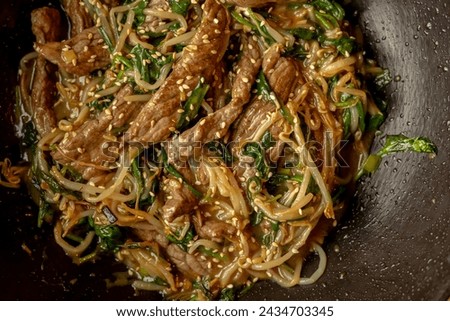 delicious Korean dish: veal in a wok close-up