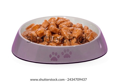 Pet bowl with wet food isolated on white background. Accessories for pets. Royalty-Free Stock Photo #2434709437