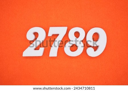 Orange felt is the background. The numbers 2789 are made from white painted wood.