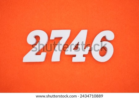 Orange felt is the background. The numbers 2746 are made from white painted wood.
