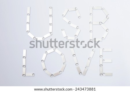 usb love written by memory sticks on white