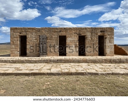 Fort Union National Monument in New Mexico. Preserves fort's adobe ruins along Santa Fe Trail. Remains of the Military Prison, which incarcerated deserters, incorrigible soldiers, spies and outlaws. Royalty-Free Stock Photo #2434776603