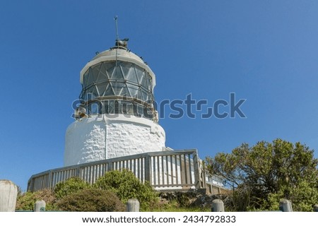 The 10-metre Nugget Point lighthouse, off the Southern Scenic Route, was first lit in 1870. Surrounded by rocky islets or nuggets, it was was automated in 1988.
 Royalty-Free Stock Photo #2434792833
