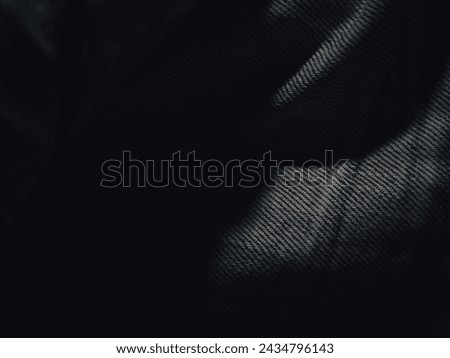 Dark jeans texture at night for a super cool fashion background.  Royalty-Free Stock Photo #2434796143