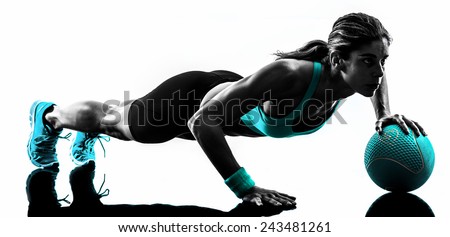 one caucasian woman exercising Medicine Ball  fitness in studio silhouette isolated on white background