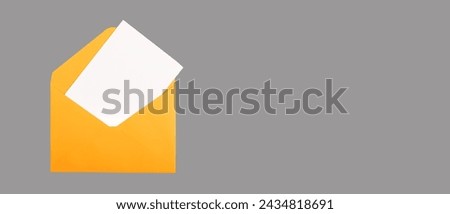 White card, blank postcard mock up in open orange envelope. Banner background, copy space.
