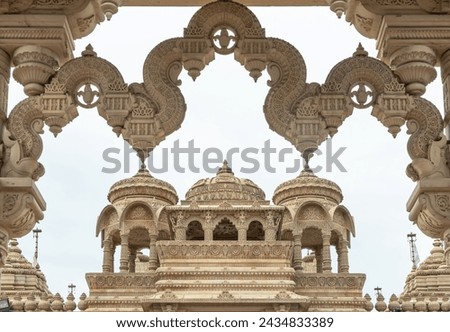 Entrance archway of The Shree Sanatan Hindu Mandir Hindu Temple (The Shri Sanatan Hindu Temple). Gates of Neasden Temple build from Elaborately carved Jaisalmer limestone, Space for text, Selective fo Royalty-Free Stock Photo #2434833389