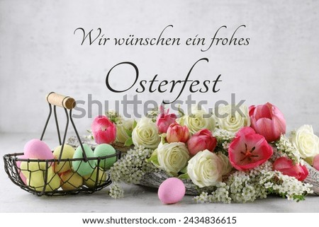Colorful Easter eggs with flowers. German inscription translated means we wish you a happy Easter.