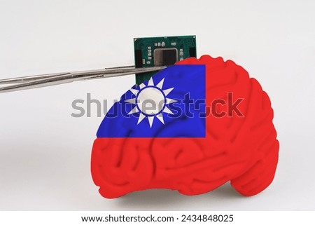 On a white background, a model of the brain with a picture of a flag - Taiwan, a microcircuit, a processor, is implanted into it. Close-up