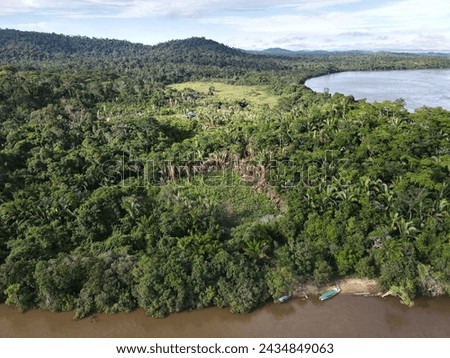 Aerial view of the indigenous land of Koatinemo, a demarcated area where the Assurini people live, on the banks of the Xingu River, State of Pará. Amazon Forest. Altamira city. Protected forest Royalty-Free Stock Photo #2434849063