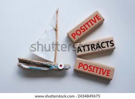 Positive attracts Positive symbol. Wooden blocks with words Positive attracts Positive. Beautiful white background with boat. Business concept. Copy space. Royalty-Free Stock Photo #2434849675