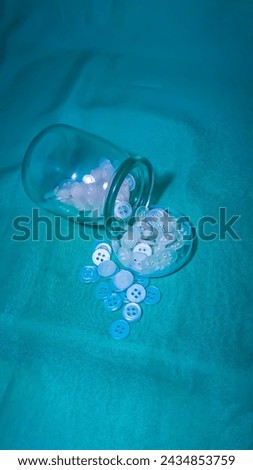 white shirt buttons in a bottle