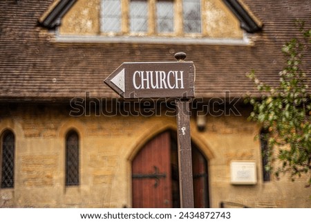 Close up view of part of church and  information sign.