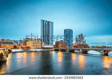 Grand Rapids, Michigan, USA downtown skyline on the Grand River at dusk. Royalty-Free Stock Photo #2434881063