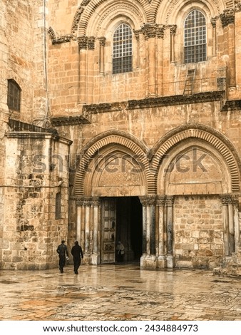 entrance to the Church of the Holy Sepulcher (Latin: Ecclesia Sancti Sepulchri) on a rainy day Royalty-Free Stock Photo #2434884973