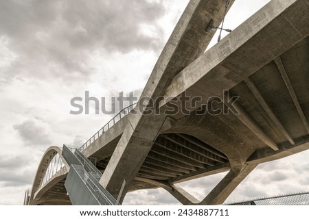 Los Angeles, CA, USA – March 6, 2024: The Sixth Street Viaduct is a bridge that connects the Arts District in downtown LA and Boyle Heights in Los Angeles, CA. Royalty-Free Stock Photo #2434887711