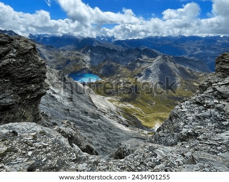 Peak Perspectives: Alpine Trail by Lake in Val d'Isere, aiguille de la grande sassière, France