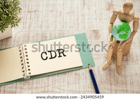 There is notebook with the word CDR. It is an abbreviation for Carbon Dioxide Removal as eye-catching image. Royalty-Free Stock Photo #2434905459
