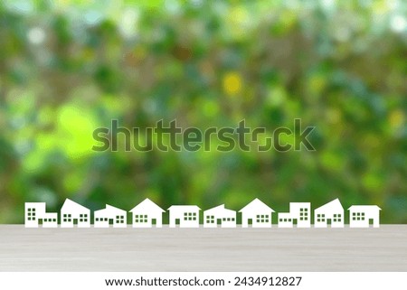 Various house icons on natural green background