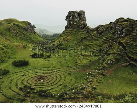 Fairy Glen with stonework in the ground, on a foggy  Royalty-Free Stock Photo #2434919881