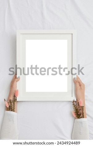 Mock-up frame empty screen front view.hand holding the frame with blank screen.Realistic frame mockup. Isolated picture frame mockup template 