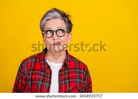 Portrait of minded pensive person look empty space contemplate ponder isolated on yellow color background Royalty-Free Stock Photo #2434933717