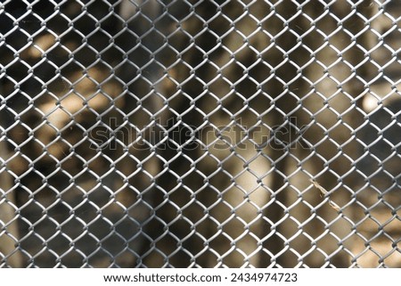 Section of a chainlink fence Royalty-Free Stock Photo #2434974723